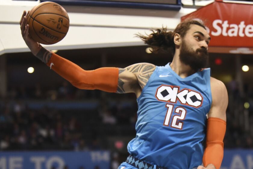 Oklahoma City Thunder center Steven Adams saves the ball from going out of bounds in the second half of an NBA basketball game against Memphis Grizzlies, Sunday, March 3, 2019, in Oklahoma City. (AP Photo/Kyle Phillips)