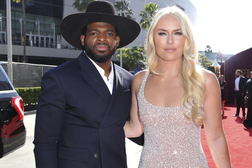 FILE - In this July 10, 2019 file photo, P.K. Subban, left, of the New Jersey Devils, and Lindsey Vonn arrive at the ESPY Awards at Microsoft Theater in Los Angeles. Vonn popped the question to hockey star Subban. “Merry Christmas and happy holidays everyone!! On our 2 year anniversary, in a “non traditional” move, I asked PK to marry me and he said, Yes," Vonn tweeted on Christmas Day. “Yes (bashful emoji) ! Women aren’t the only ones who should get engagement rings!" The former ski racer closed the tweet with the hashtags “MerryChristmas" and “equality." Vonn linked a picture of herself and Subban with the ring, with the couple wearing matching striped pajamas in front of a Christmas tree with three dogs in the foreground. She also posted a close-up of Subban flashing the ring, with the words “drip drip”and a blue teardrop. Vonn also said on social media in August that they were engaged. (Photo by Richard Shotwell/Invision/AP, File)