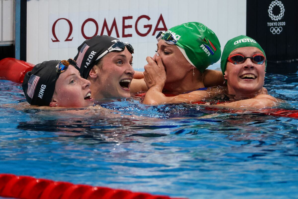 South Africa's Tatjana Schoenmaker is congratulated by teammate Kaylene Corbet, Lilly King and Annie Lazor.