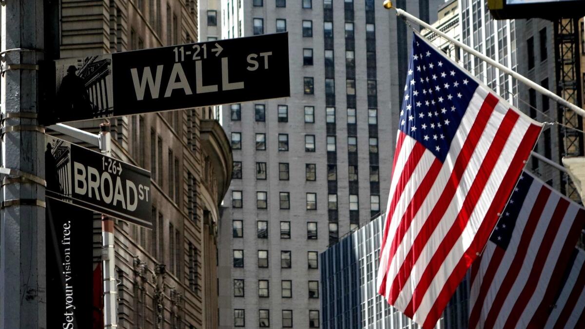 A U.S. flag flies on the front of the New York Stock Exchange.