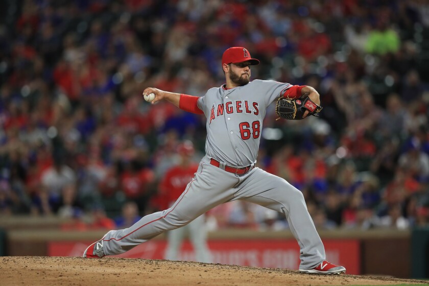 Angels reliever Cam Bedrosian (68) throws against the Rangers in the eighth inning.