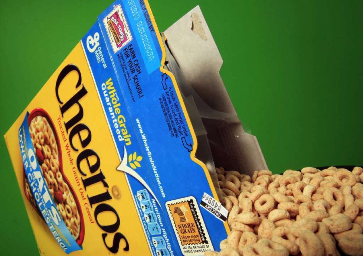 General Mills said it will stop sourcing genetically modified corn and sugar cane for its signature breakfast cereal.