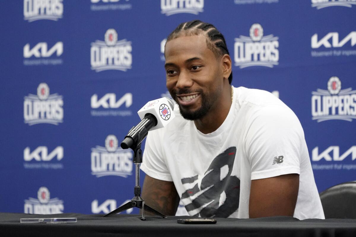 Clippers forward Kawhi Leonard is all smiles while answering a question during media day.