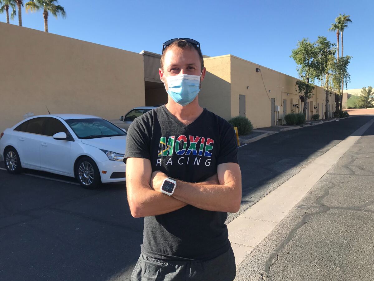 James Haycraft, 35, stands in a parking lot near an early-voting site in Scottsdale, Ariz. 