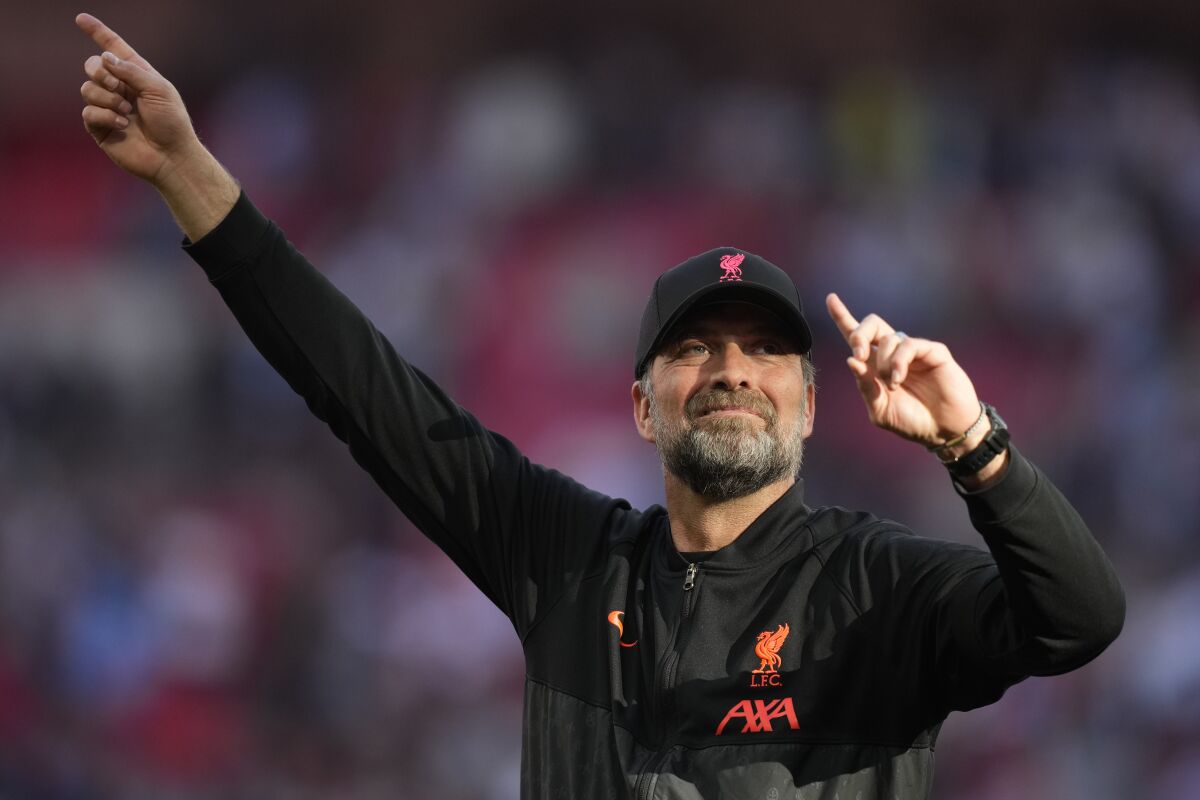 Liverpool's manager Jurgen Klopp applauds fans at the end of the English FA Cup semifinal soccer match between Manchester City and Liverpool at Wembley stadium in London, Saturday, April 16, 2022. (AP Photo/Frank Augstein)