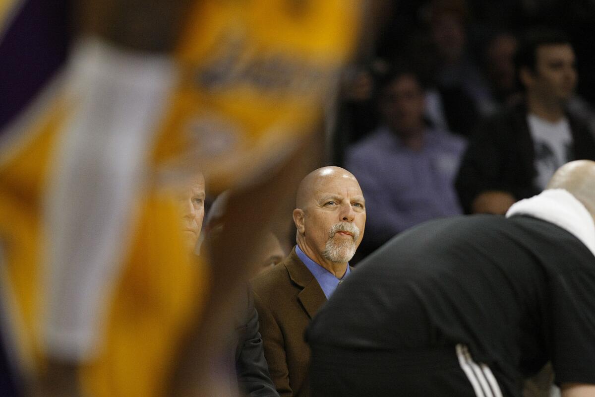 Lakers trainer Gary Vitti sit on the bench during a game against the Toronto Raptors on March 8, 2013.