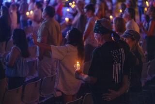 People attend a prayer vigil Friday, Aug. 25, 2023, at Saddleback Church in Lake Forest, Calif., for victims of Wednesday's shootings at Cook's Corner in Trabuco Canyon. (AP Photo/Damian Dovarganes)