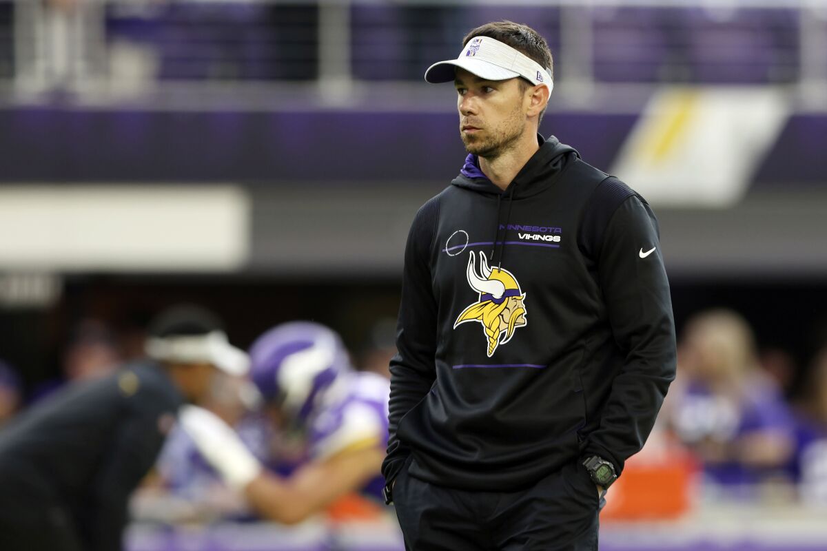 FILE - Minnesota Vikings offensive coordinator Klint Kubiak watches pregame warmups prior to an NFL preseason football game against the Indianapolis Colts, on Aug. 21, 2021, in Minneapolis. The Carolina Panthers have interviewed Minnesota Vikings offensive coordinator Klint Kubiak and Indianapolis Colts wide receivers coach Mike Groh for their vacant offensive coordinator position, according to a person familiar with the situation. The person spoke to The Associated Press on condition of anonymity Wednesday, Jan. 12, 2022, because the team does not announce its interviews. (AP Photo/Stacy Bengs, File)
