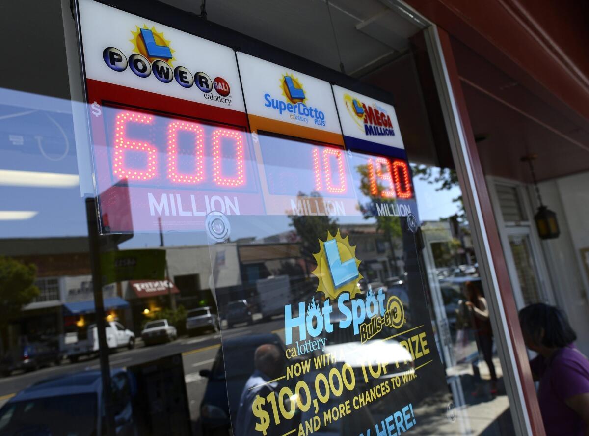 A digital sign at a doughnut store in Oakland displays lottery jackpots after California joined the Powerball game.