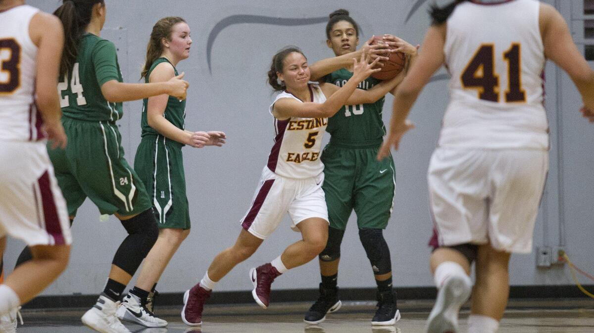 Sage Hill School’s Joyce Jogwe steals the ball from Estancia’s Isabelle Cruz (5) during the first half in the Orange tournament game at Orange High School on Thursday.