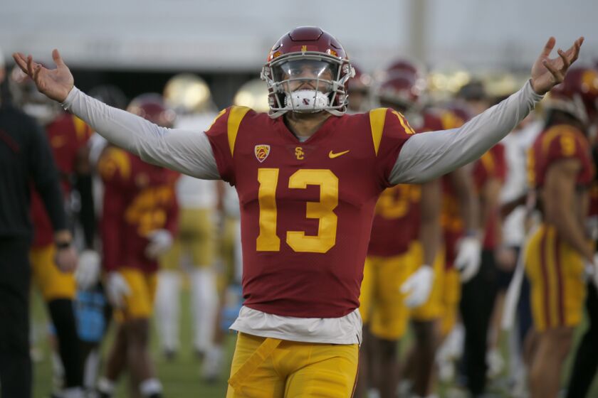 USC quarterback Caleb Williams warms up before playing Notre Dame in the storied football rivalry.