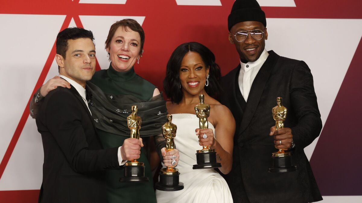 Oscar winners Rami Malek, left, Olivia Coleman, Regina King and Mahershala Ali pose with their Academy Awards at the 2019 ceremony.