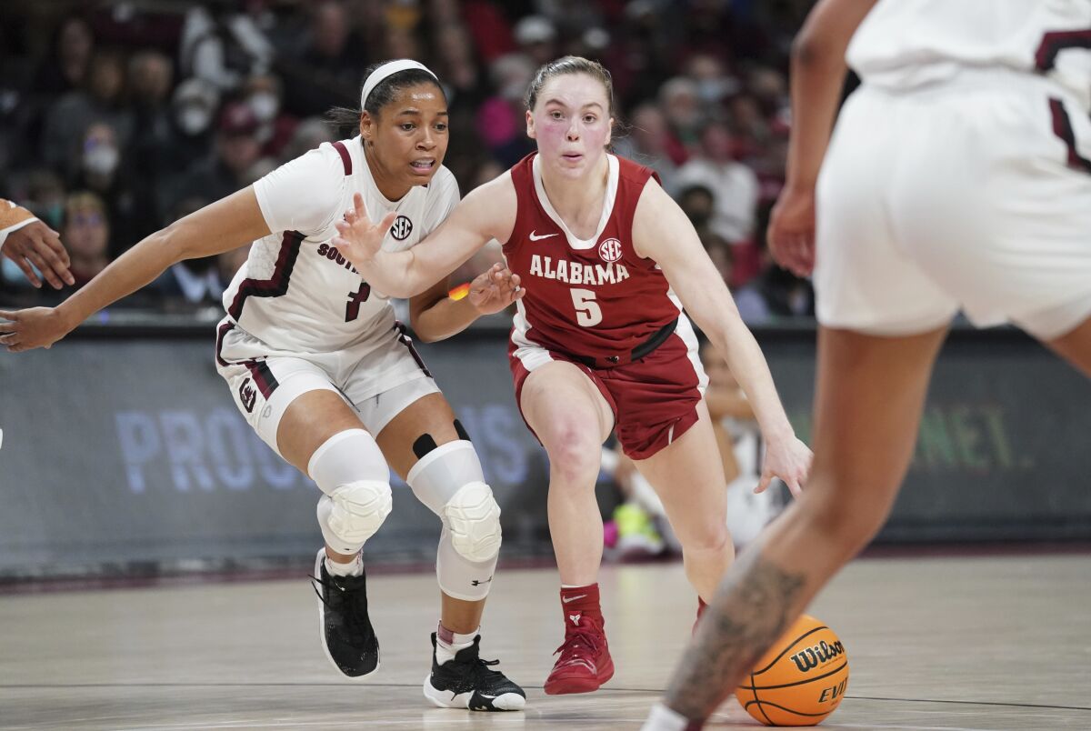 Alabama guard Hannah Barber (5) dribbles against South Carolina guard Zia Cooke (1) during the first half of an NCAA college basketball game Thursday, Feb. 3, 2022, in Columbia, S.C. (AP Photo/Sean Rayford)
