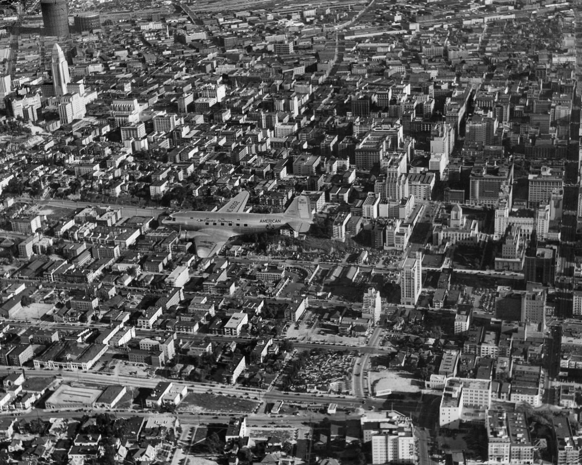 American Airlines DC-3 photographed flying over downtown Los Angeles in 1940.