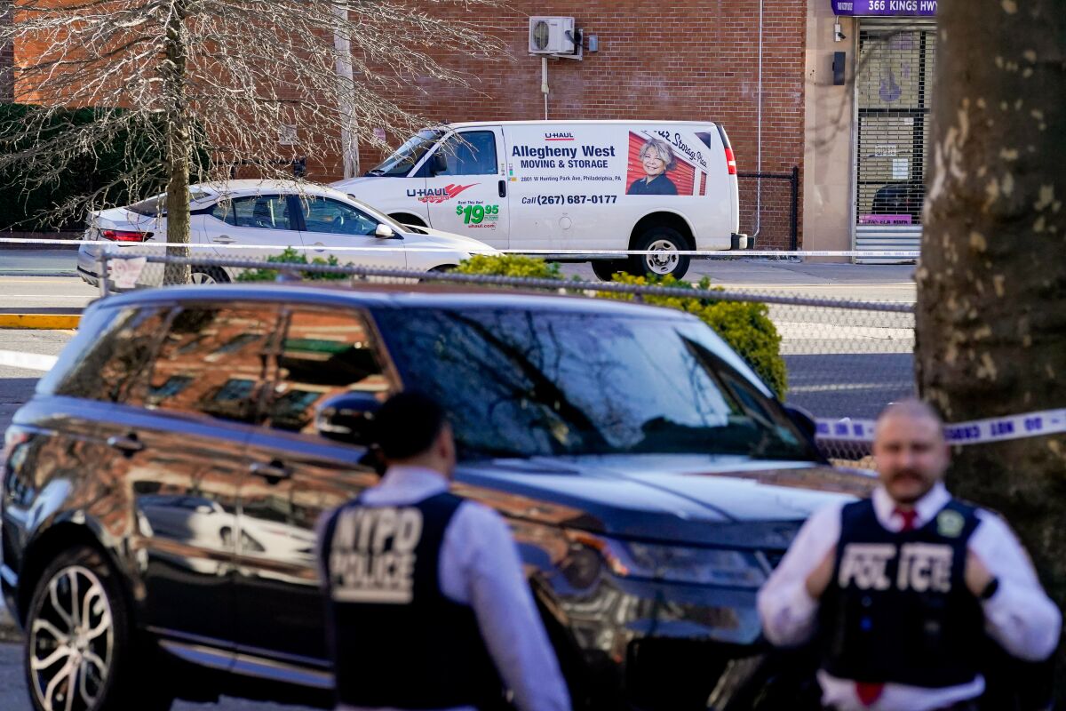 Emergency personnel guard a van
