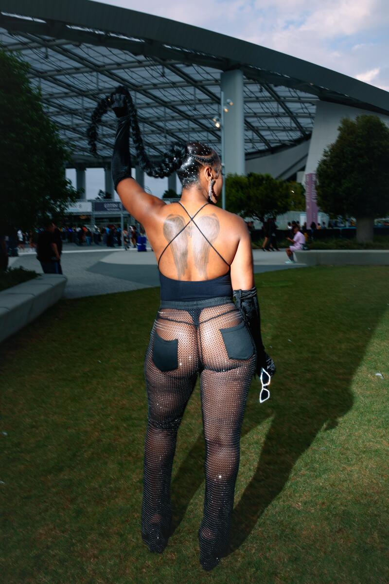 A woman poses at a concert