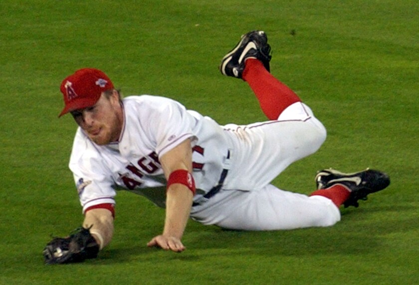 Angels center fielder Darin Erstad makes a jump catch during the 2002 World Series.