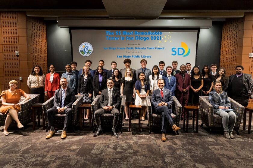 San Diego's "25 Most Remarkable Teens" pose Wednesday night with city and county leaders at the San Diego Central Library. 