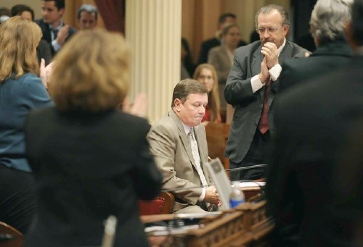 Former state Sen. Dave Cogdill (R-Modesto), seated on the floor in 2010.