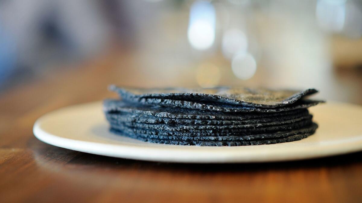 A stack of heirloom conico blue tortillas at Taco Maria in Costa Mesa.