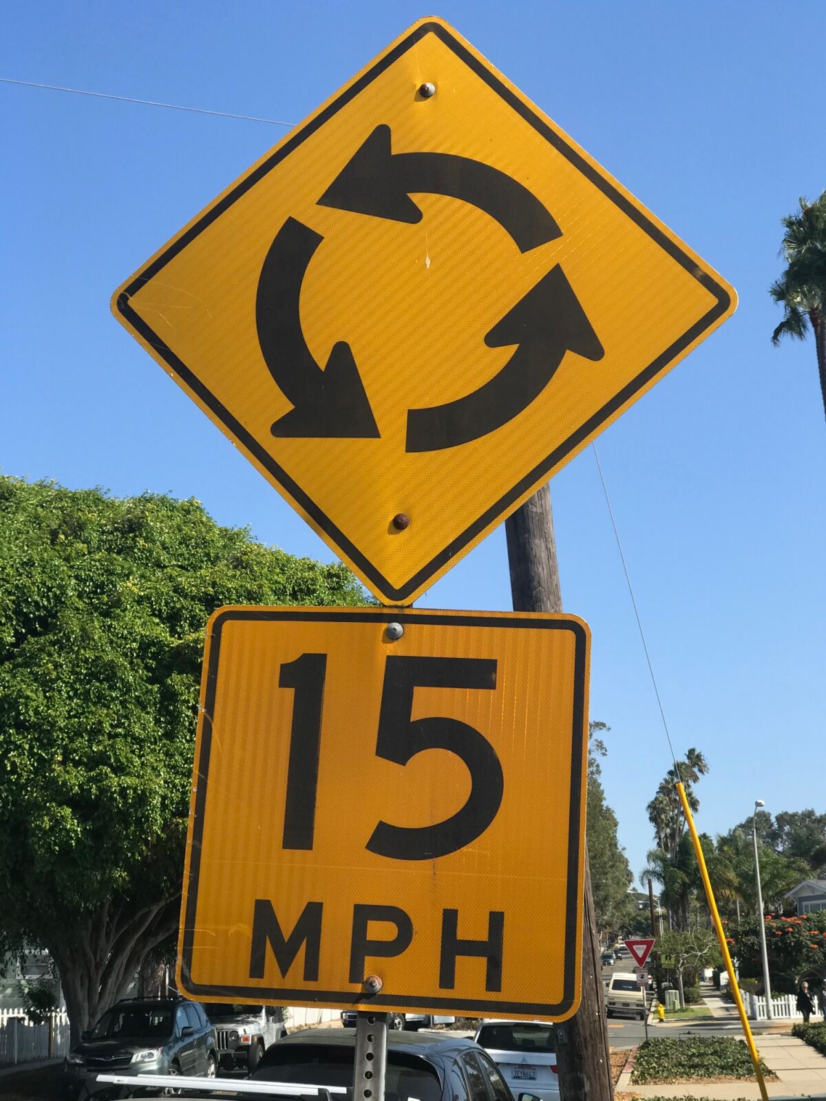 This is the street sign for a roundabout, which Inga says "are confusing and terrifying to just about everyone."