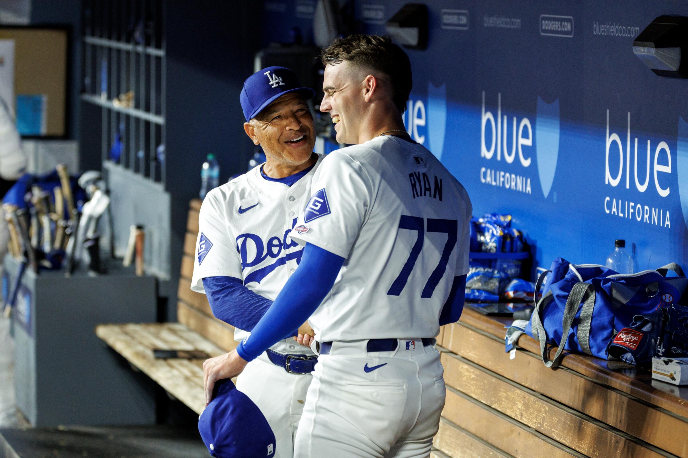 Dodgers manager Dave Roberts congratulates River Ryan after the starting pitcher's MLB debut.