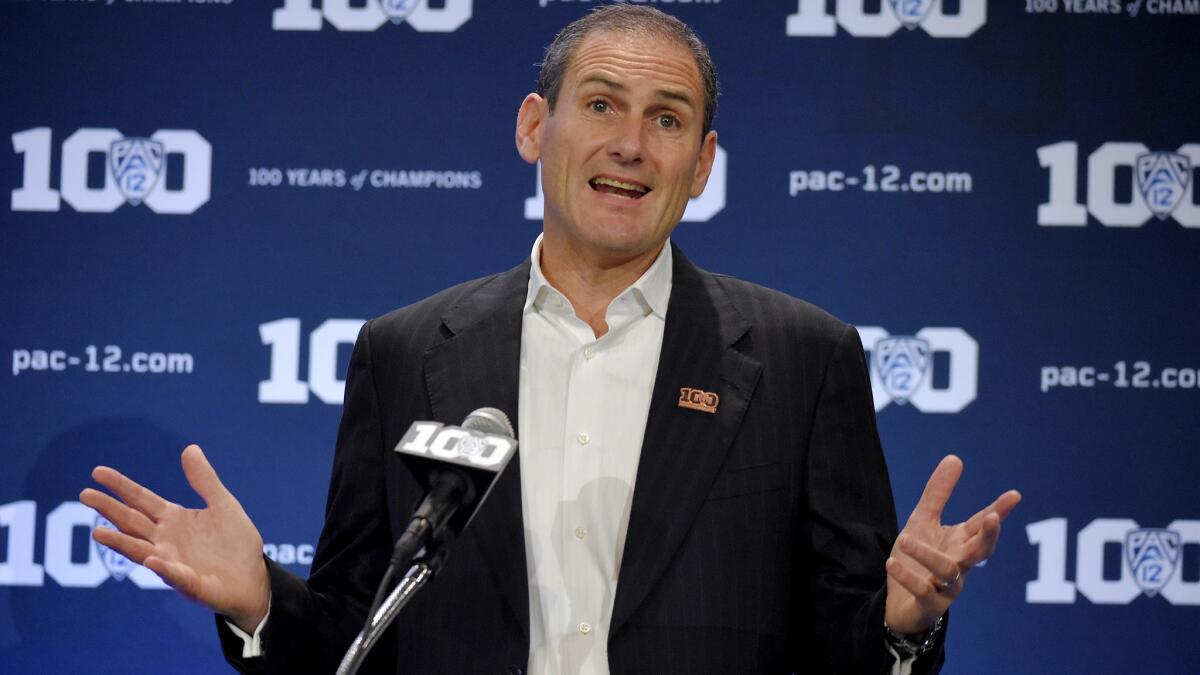 Pac-12 Commissioner Larry Scott talks to reporters during football media day on July 10.