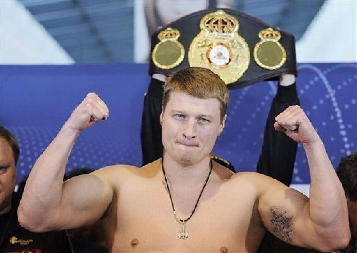 Alexander Povetkin of Russia poses at a weigh-in before a title bout in 2012.