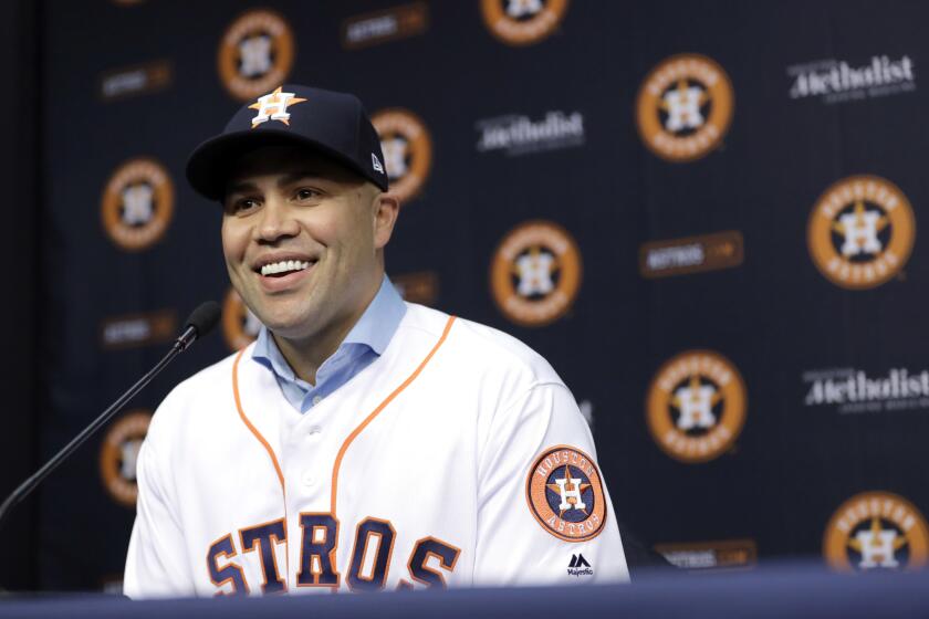 Carlos Beltran smiles during a news conference to announce his signing a one-year contract with the Astros in 2016.
