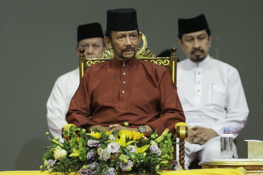 (FILES) In this file photo taken on April 03, 2019 Brunei's Sultan Hassanal Bolkiah (C) attends an event in Bandar Seri Begawan. - Brunei's sultan has announced death by stoning for gay sex and adultery will not be enforced after a global backlash, but critics on May 6 called for harsh sharia laws to be abandoned entirely. (Photo by STRINGER / AFP) / Brunei OUTSTRINGER/AFP/Getty Images ** OUTS - ELSENT, FPG, CM - OUTS * NM, PH, VA if sourced by CT, LA or MoD **