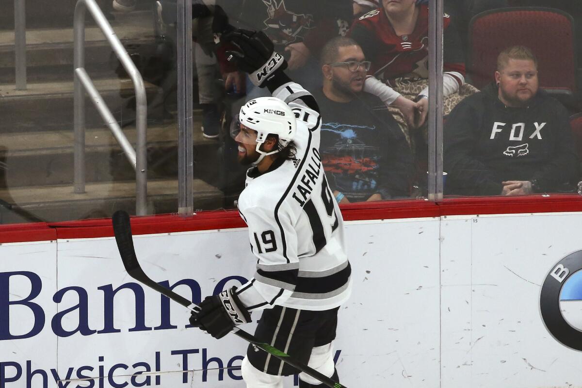Kings left wing Alex Iafallo celebrates after scoring a game-winning goal against the Coyotes in overtime to complete a hat trick on Jan. 30 at Gila River Arena.
