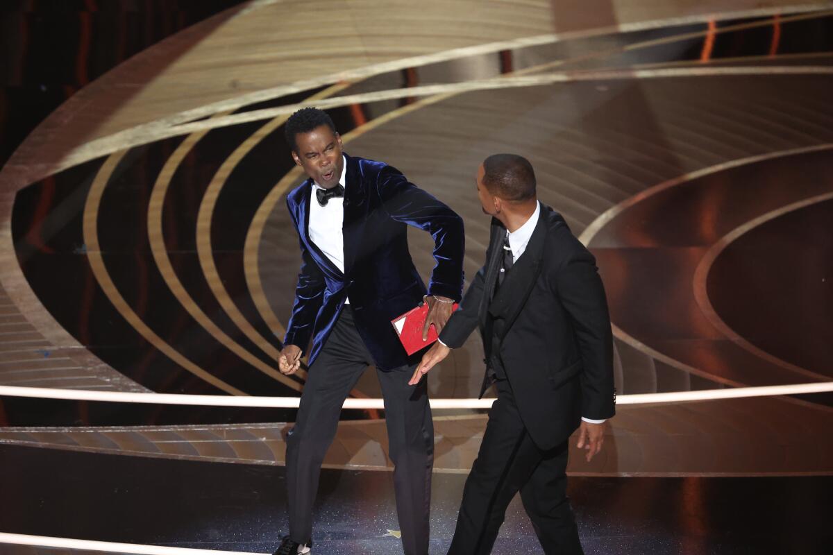 Chris Rock and Will Smith onstage at the 94th Academy Awards.