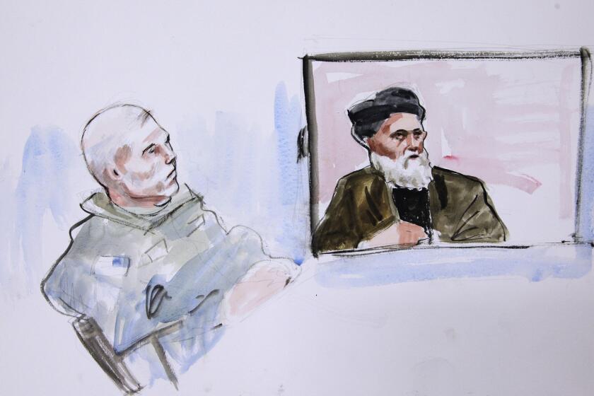 Staff Sgt. Robert Bales looks on as Haji Mohammed Naim testifes from Afghanistan in this courtroom drawing.
