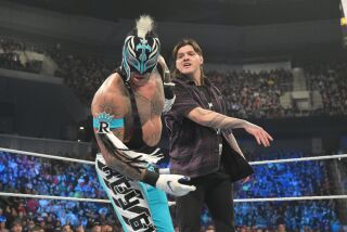 Rey Mysterio is slapped by his son Dominik during one of the most compelling WrestleMania story lines.