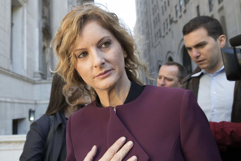 FILE - In this Oct. 18, 2018 file photo, Summer Zervos leaves New York state appellate court in New York. Lawyers for a woman who accused President Donald Trump of unwanted kissing and groping in 2007 say records from his own calendar help prove her claim. Trump lawyer Marc Kasowitz responded Thursday, Oct. 24, 2019, that Zervos’ claims are “entirely meritless and not corroborated by any documents.” (AP Photo/Mary Altaffer, File)