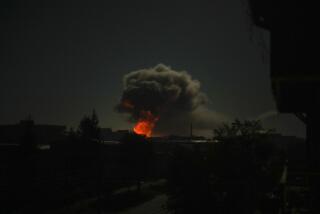 Smoke rises after big explosions in Kharkiv, Ukraine, early Saturday, Oct. 8, 2022. (AP Photo/Francisco Seco)