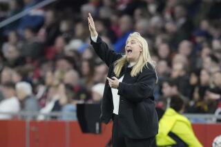 Chelsea's coach Emma Hayes gestures during the Women's Champions League quarterfinal soccer match between Ajax and Chelsea at the Johan Cruyff ArenA, in Amsterdam, Netherlands, Tuesday, March 19, 2024. (AP Photo/Peter Dejong)