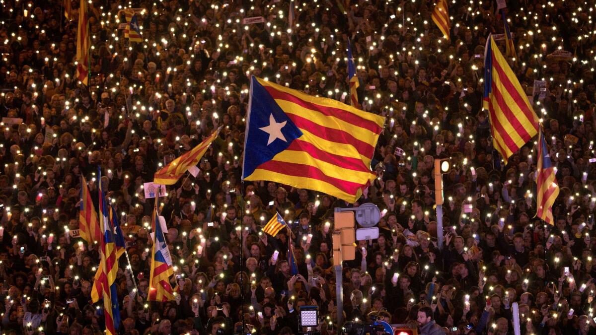 Demonstrators gather on Saturday, Nov. 11, 2017 in Barcelona, Spain, during a protest calling for the release of jailed Catalan politicians.