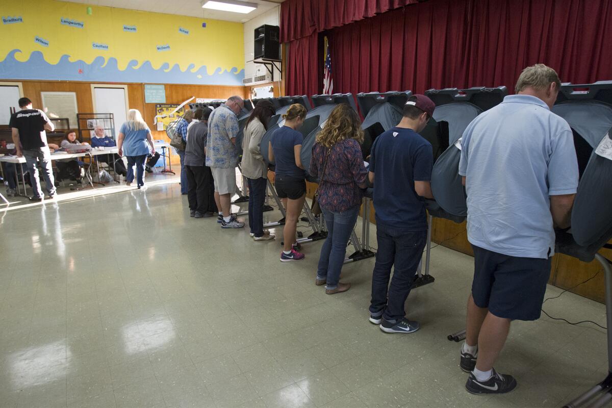 Voters at Paularino Elementary School in Costa Mesa on Tuesday.