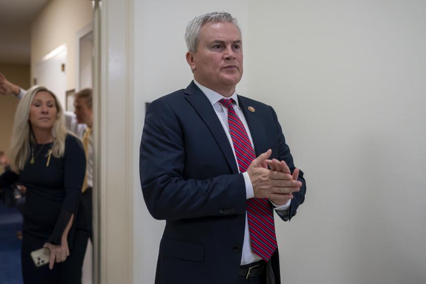 FILE - House Oversight and Accountability Committee Chairman James Comer, R-Ky., emerges from the committee room, followed by Rep. Marjorie Taylor Greene, R-Ga., to speak to reporters after Hunter Biden, President Joe Biden's son, defied a congressional subpoena to appear privately for a deposition before Republican investigators who have been digging into his business dealings, at the Capitol in Washington, Wednesday, Dec. 13, 2023. (AP Photo/J. Scott Applewhite, File)