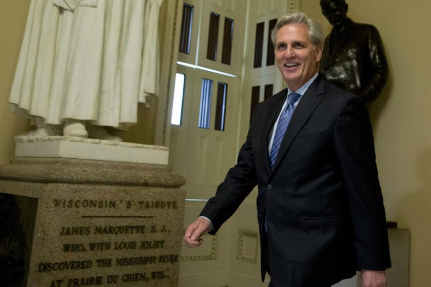 House Majority Leader Kevin McCarthy of California walks toward the House Chamber on Capitol Hill.