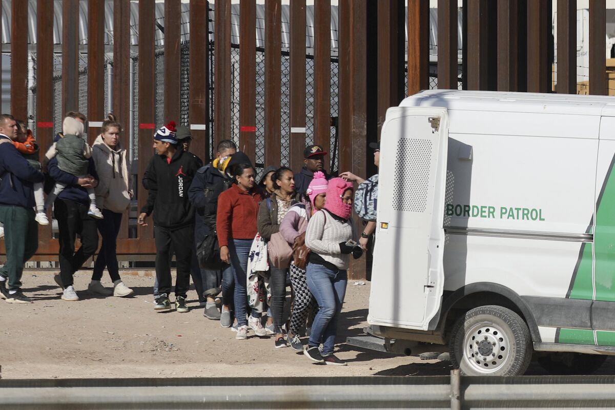 Venezuelan and Nicaraguan migrants are transferred by agents of the Border Patrol after crossing the Rio Grande.