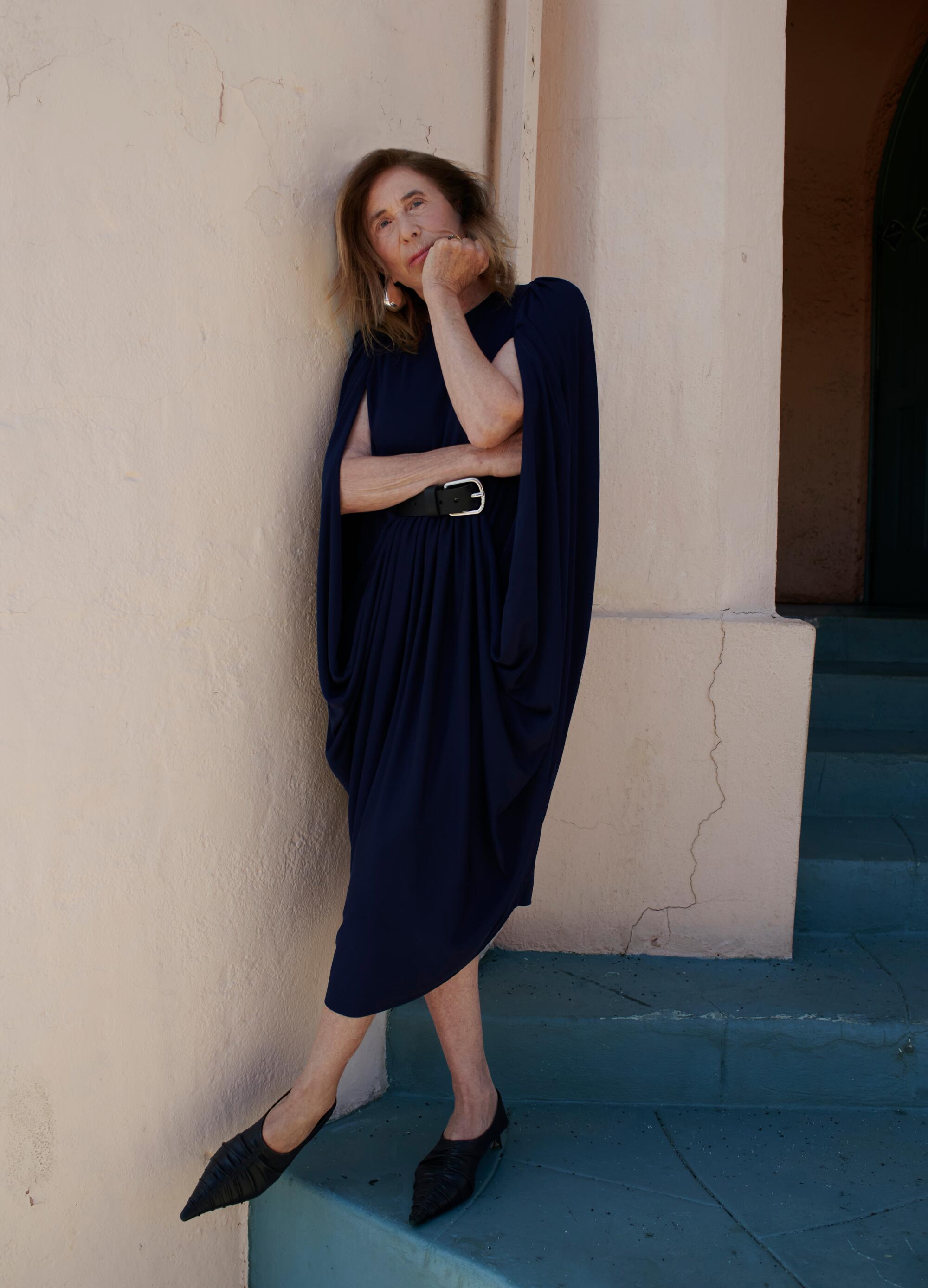 Chris Kraus wears Loewe dress, Stella McCartney shoes, Bottega Veneta earrings.