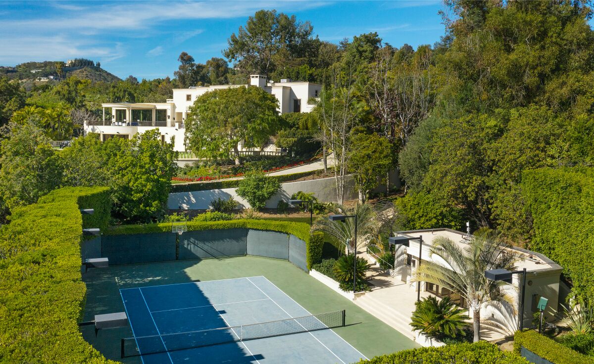 White mansion and tennis court 