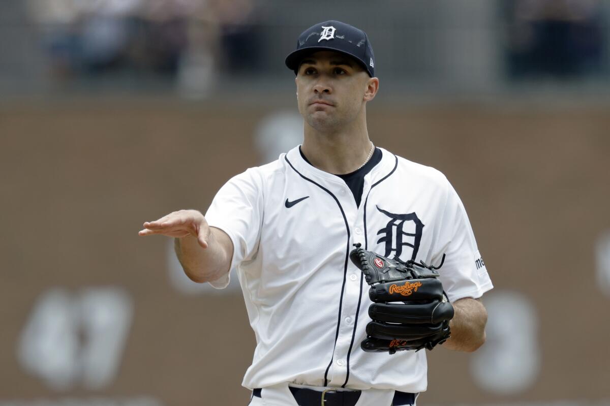 Right-handed pitcher Jack Flaherty wearing a Tigers home uniform and black Rawlings glove