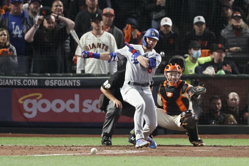 San Francisco, CA - October 14: Los Angeles Dodgers' Gavin Lux hits a single during the ninth inning in game five of the 2021 National League Division Series against the San Francisco Giants at Oracle Park on Thursday, Oct. 14, 2021 in San Francisco, CA. (Robert Gauthier / Los Angeles Times)