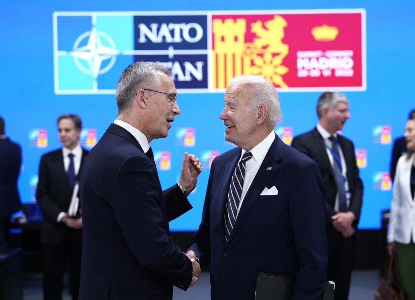 NATO chief and President Biden shaking hands