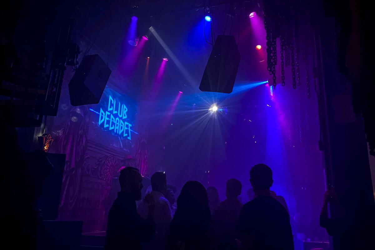 People inside a dark nightclub