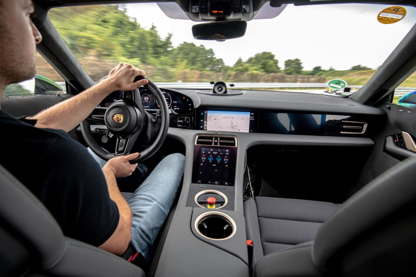 The Taycan's interior is filled with digital technology. That challenged designers to maintain Porsche's classically clean look while modernizing the cockpit.