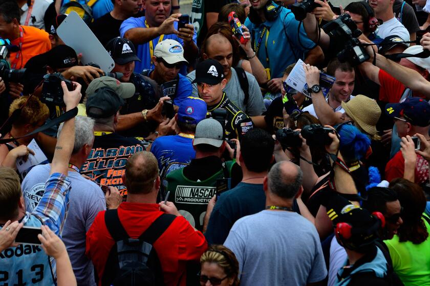 Jeff Gordon draws a crowd Saturday during practice for his final NASCAR Sprint Cup Series race.